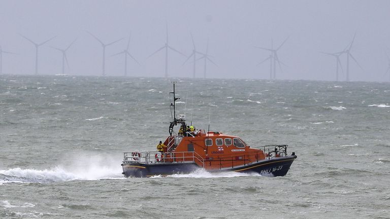 A RNLI lifeboat searches for the two missing fishermen