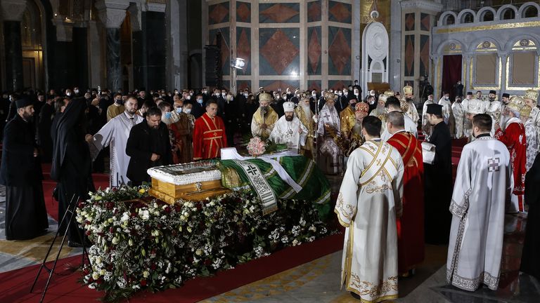Orthodox priests hold the church service during the funeral of the late Serbian Patriarch Irinej 