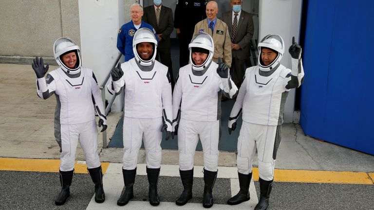 Crew members of a SpaceX Falcon 9 rocket commander Mike Hopkins, Victor Glover, Shannon Walker and Japanese astronaut Soichi Noguchi, gesture as they depart for the launch pad for the first operational NASA commercial crew mission at Kennedy Space Center in Cape Canaveral, Florida, U.S. November 15, 2020. REUTERS/Joe Skipper TPX IMAGES OF THE DAY
