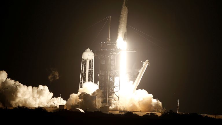 A SpaceX Falcon 9 rocket, with the Crew Dragon capsule, is launched