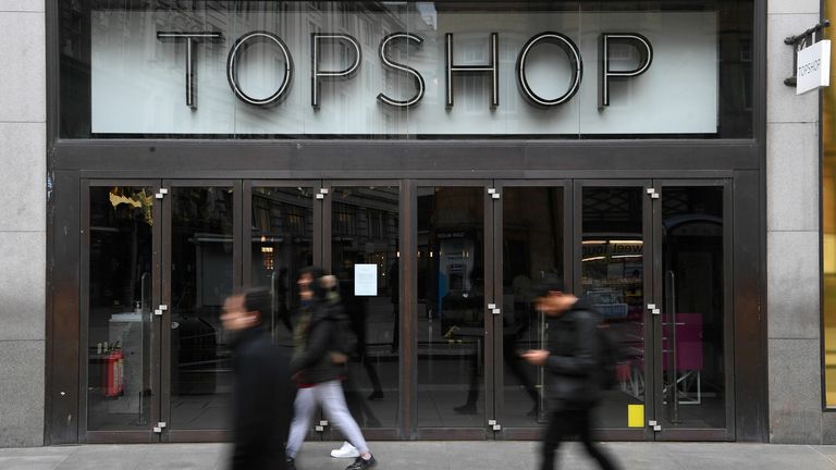Pedestrians walk past a temporarily closed-down Topshop store on Oxford Street in London on November 26, 2020. - Britain&#39;s government on Wednesday unveiled plans to slash the foreign aid budget to help mend its coronavirus-battered finances, prompting one minister to quit and defying impassioned calls to protect the world&#39;s poorest people. (Photo by DANIEL LEAL-OLIVAS / AFP) (Photo by DANIEL LEAL-OLIVAS/AFP via Getty Images)