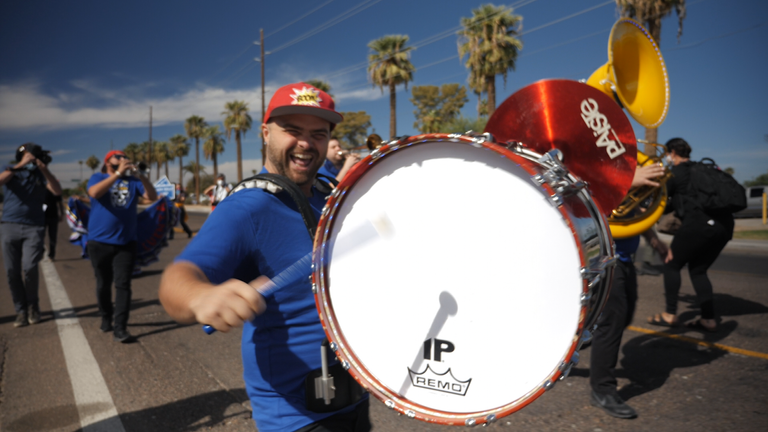 A marching band drums up support during campaigning in Phoenix