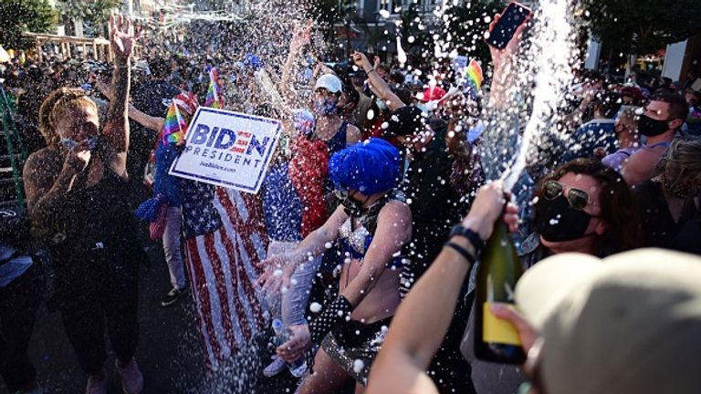 People sprayed champagne in the Castro district of San Francisco