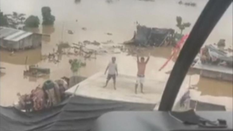 People remained stranded on rooftops as flooding persisted in the Philippines’ Cagayan province. At least 42 people have died