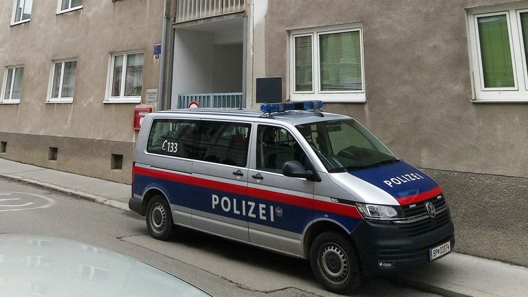 A police car stands in front of a residential building in Sankt Poelten, Austria, where raids were carried out on November 3, 2020 in connection with the Vienna shooting one day before. - The only known gunman in the Vienna attack which left four people dead was a convicted supporter of the Islamic State group and had dual Macedonian-Austrian nationality, Austria&#39;s interior minister said. 