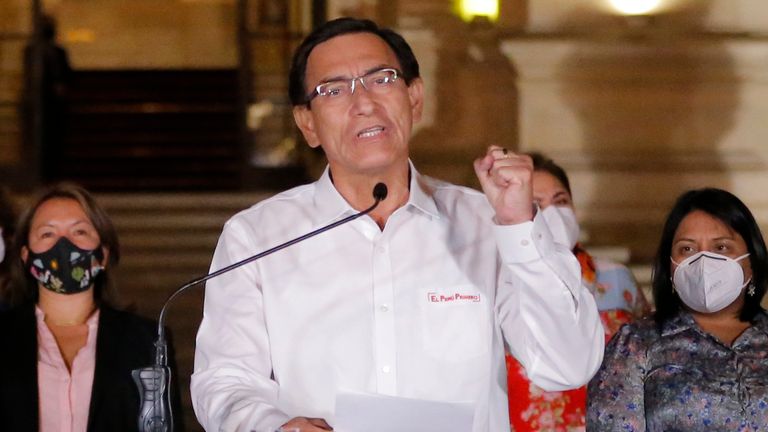 Peruvian President Martin Vizcarra (C) gives a farewell statement to the press before leaving the presidential Palace in Lima, following his impeachment by an overwhelming majority Congress vote on November 9, 2020, during a second political trial against him in less than two months. 