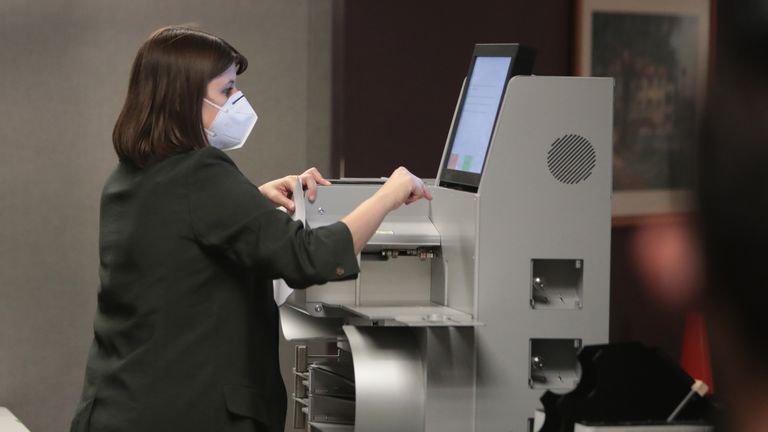 MILWAUKEE, WISCONSIN - NOVEMBER 04: Claire Woodall-Vogg, executive director of the Milwaukee election commission collects the count from absentee ballots from a voting machine on November 04, 2020 in Milwaukee, Wisconsin. Wisconsin requires election officials to wait to begin counting absentee ballots until after polls open on election day. The Milwaukee count was finished about 3AM. (Photo by Scott Olson/Getty Images)