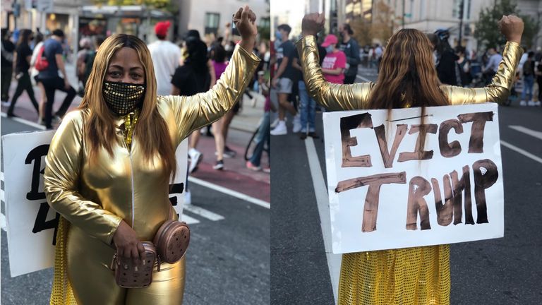 Monica Nichols, 50, dressed for the occasion to celebrate Joe Biden's election, in a shiny gold catsuit with a sign on her back declaring, “Evict Trump.”