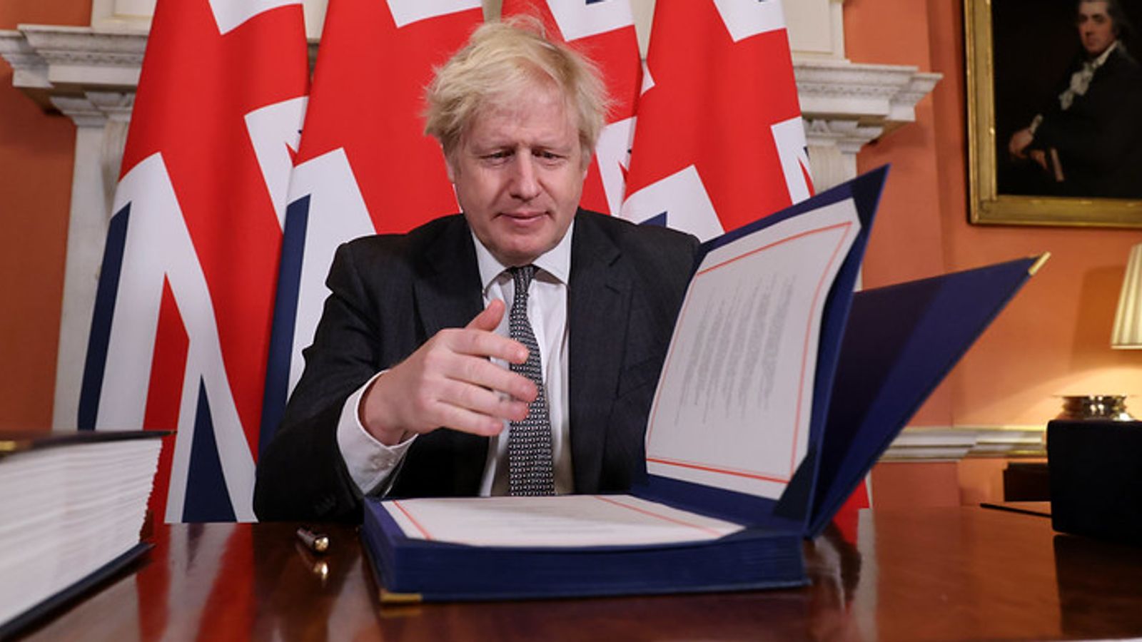 Brexit: Boris Johnson signs Brexit trade deal after MPs give overwhelming backing for EU agreement