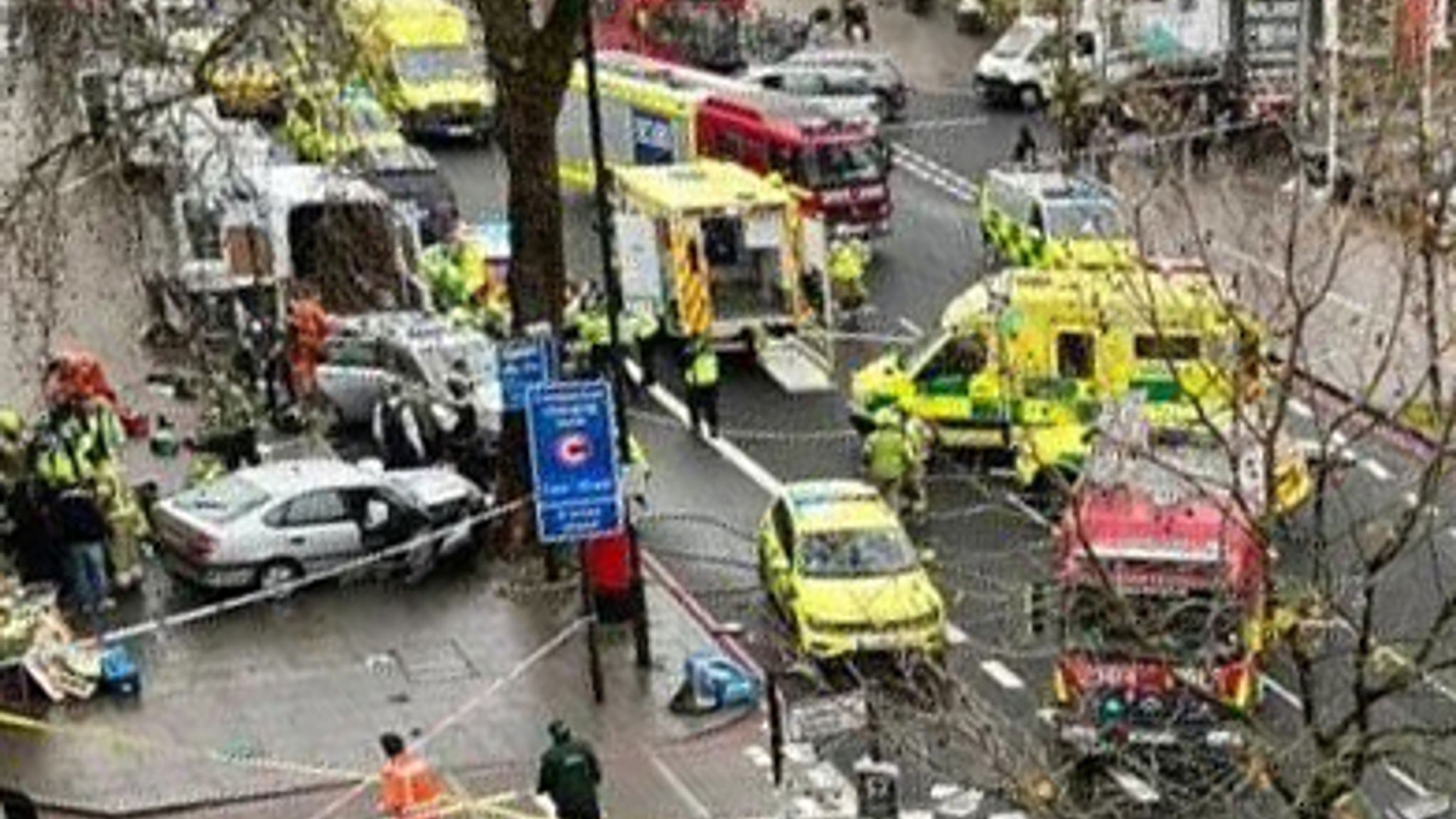 Hackney crash At least five people injured after car mounts pavement