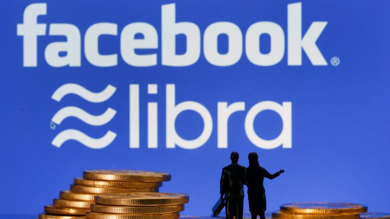 PARIS, FRANCE - OCTOBER 15: In this photo illustration, a visual representation of digital cryptocurrency coins sit on display in front of Libra and Facebook logos on October 15, 2019 in Paris, France. The founding members of Facebook's future virtual currency, Libra, met Monday in Geneva to sign a charter, despite the defection of several partners, including Paypal, Visa, Mastercard or eBay. Facebook announced the creation in mid-June of a digital currency offering an alternative payment method to traditional banking channels. This digital currency, whose launch is scheduled for mid-2020 if it is authorized by the regulators, will be managed by the Libra association, based in Geneva. (Photo by Chesnot/Getty Images)