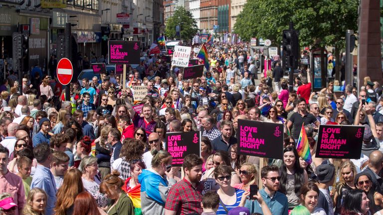 Campaigners attend a rally in Belfast to show their support for marriage equality.