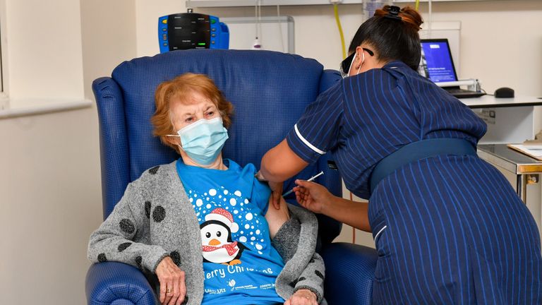 Margaret Keenan, 90, is the first patient in the United Kingdom to receive the Pfizer/BioNtech covid-19 vaccine at University Hospital, Coventry, administered by nurse May Parsons, at the start of the largest ever immunisation programme in the UK's history.