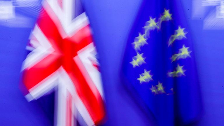 This picture taken on December 9, 2020, shows flags of the Union Jack and the EU ahead of Britain&#39;s Prime Minister&#39;s meeting on post Brexit trade deal with European Commission President, in Brussels. - Britain&#39;s Prime Minister arrives in Brussels on December 9, 2020, with hopes for a post-Brexit trade deal hanging on crisis talks with EU chief. Talks are blocked over the issue of fair competition, with Britain refusing to accept a mechanism that would allow the EU to respond swiftly if UK and EU business rules diverge over time and put European firms at a disadvantage. (Photo by Olivier HOSLET / POOL / AFP) (Photo by OLIVIER HOSLET/POOL/AFP via Getty Images)