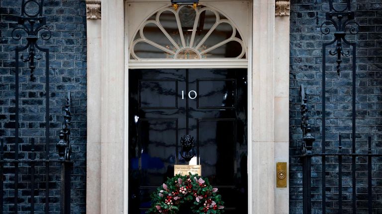A festive wreath hangs on the door of 10 Downing Street in central London on December 13, 2020, as the leaders of Britain and the European Union agree to contine talks beyond the latest deadline. - Britain due to leave the EU single market in 19 days. (Photo by Tolga Akmen / AFP) (Photo by TOLGA AKMEN/AFP via Getty Images)