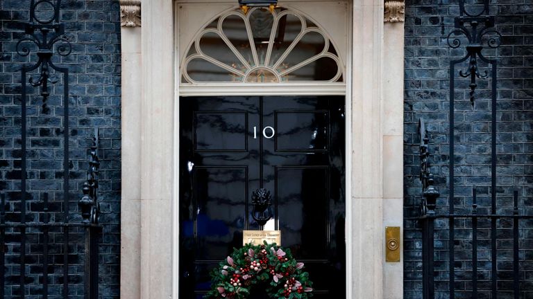 A festive wreath hangs at Door 10 Downing Street in central London on December 13, 2020, as British and European Union leaders agreed to continue talks after the last deadline.  Britain is scheduled to leave the European Union's single market within 19 days.  (Photo by Tolga Akmen / AFP) (Photo by Tolga Akmen / AFP via Getty Images)