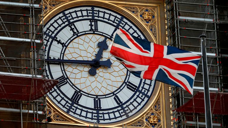 The Union flag flutters near the clockface of Big Ben during ongoing renovations to the Tower and the Houses of Parliament, in central London on January 7, 2020. (Photo by Adrian DENNIS / AFP) (Photo by ADRIAN DENNIS/AFP via Getty Images)