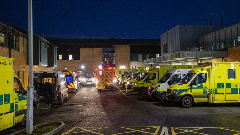 Ambulances at the entrance to the emergency department with a number of the vehicle with patients awaiting to be admitted, at Antrim Area Hospital, Co Antrim in Northern Ireland, as the emergency department and hospital is currently at full capacity.