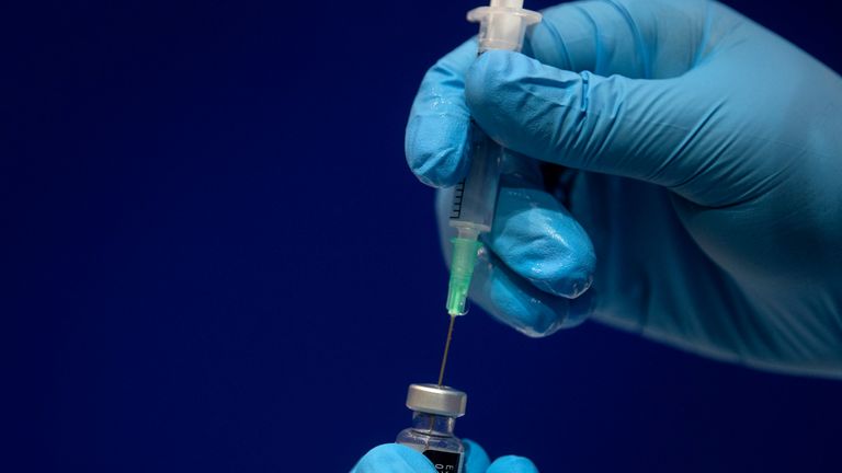 1.8ml of Sodium chloride is added to a phial of the Pfizer/BioNTech COVID-19 vaccine concentrate ready for administration at Guy's Hospital, in central London on December 8, 2020. - Britain on December 8 hailed a turning point in the fight against the coronavirus pandemic, as it begins the biggest vaccination programme in the country's history with a new Covid-19 jab. (Photo by Victoria Jones / POOL / AFP) (Photo by VICTORIA JONES/POOL/AFP via Getty Images)