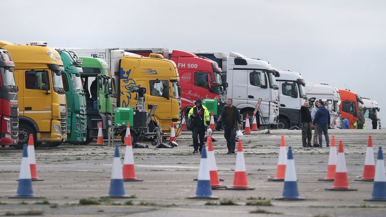 Cargo trucks line up at the top of a queue on the tarmac at Manston Airport, Kent, after France imposed a 48-hour ban on entering the United Kingdom following fears of the spread of a new strain of coronavirus.