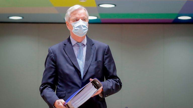 EU Chief Negotiator for Brexit Michel Barnier carries a folder containing the 2000 page 'Brexit Trade Deal' as he arrives ahead of a special meeting of The Committee of the Permanent Representatives of the Governments of the Member States to the European Union (Coreper) at the European Council in Brussels on December 25, 2020. (Photo by Olivier HOSLET / POOL / AFP) (Photo by OLIVIER HOSLET/POOL/AFP via Getty Images)