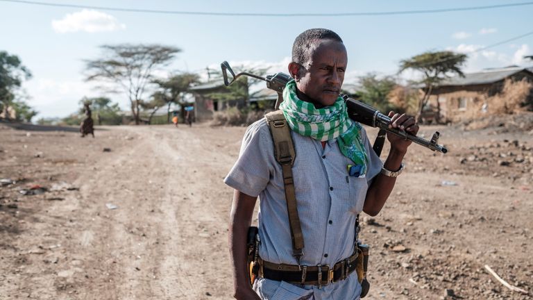 A member of the militia holds a weapon in the village of Bisober, in Ethiopia's Tigray region, on December 9, 2020. - The November 14 killings represent just one incident of civil suffering in Bisober, an agricultural village which is home to approximately 2,000 people in Tigray.  In hindsight, Bisober residents say, the first sign of conflict came seven months ago, when members of the Tigray Special Forces took over the village's primary school, which had been emptied due to the coronavirus pandemic.  (Photo by EDUARDO SOTERAS / AFP) (Photo by EDUARDO SOTERAS / AFP via Getty Images)