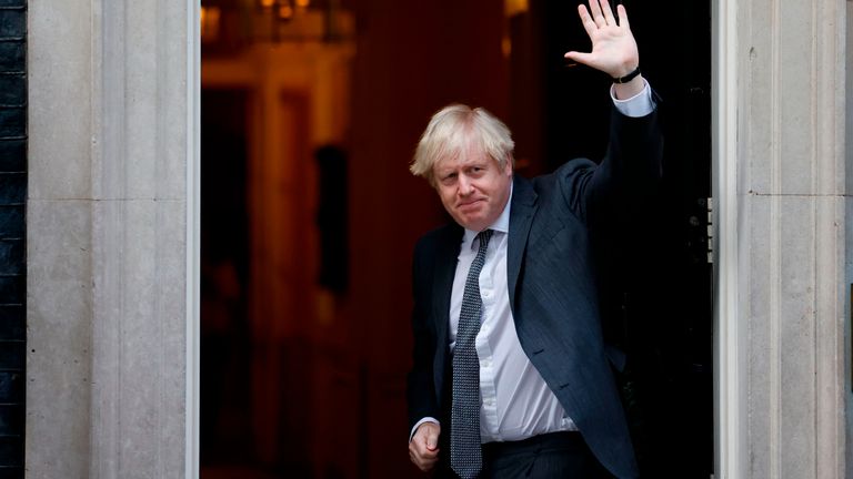 Britain's Prime Minister Boris Johnson gestures to members of the media as he arrives back at 10 Downing Street in London on December 30, 2020, after voting on the second reading of the EU (Future Relationship) Bill in the House of Commons. - Members of the British parliament debated and voted on legislation on the UK's future relationship with the EU as EU leaders signed their post-Brexit trade deal with Britain and dispatched it to London on an RAF jet, setting their seal on a drawn-out divorce. (Photo by Tolga Akmen / AFP) (Photo by TOLGA AKMEN/AFP via Getty Images)