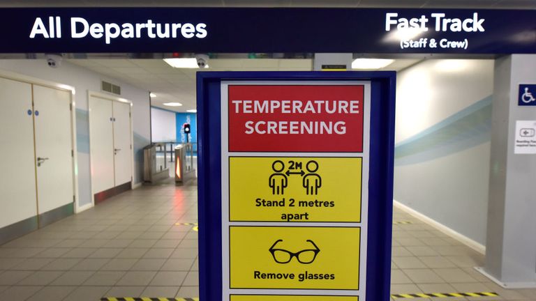 SOUTHEND-ON-SEA, ENGLAND - JUNE 18: A "Temperature Screening" sign and fever screening thermographic cameras which can measure higher body temperature at the departure gate as London Southend airport prepares for the reintroduction of passenger flights on June 18, 2020 in Southend-on-Sea, England. As the British government further relaxes Covid-19 lockdown measures in England, this week sees preparations being made to open non-essential stores and Transport for London handing out face masks