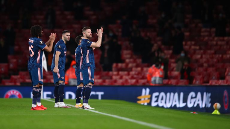 Arsenal's Scotran Mustafa and some team fans cheer ahead of the UEFA Europa League Group B match between Arsenal FC and Rapid Wein on December 3, 2020 at the Emirates Stadium in London, England.