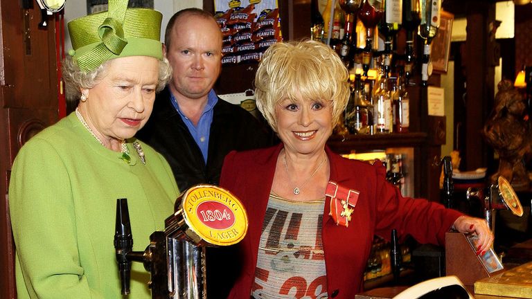 Barbara Windsor with the Queen and actor Steve McFadden in the Queen Vic pub in EastEnders