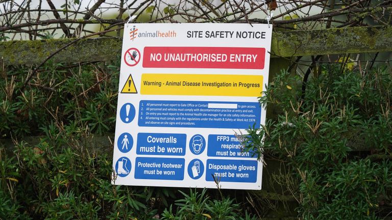  A warning sign hangs from a fence at a farm near Northallerton after an outbreak of Avian flu 