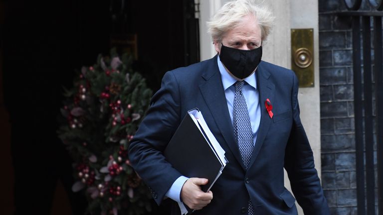 Prime Minister Boris Johnson leaving Downing Street in London to vote on the new coronavirus restrictions for England.