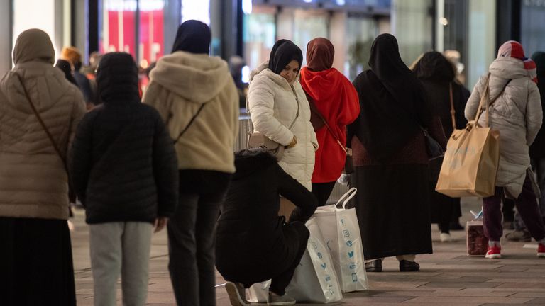 Shoppers queue outside Next in Leicester