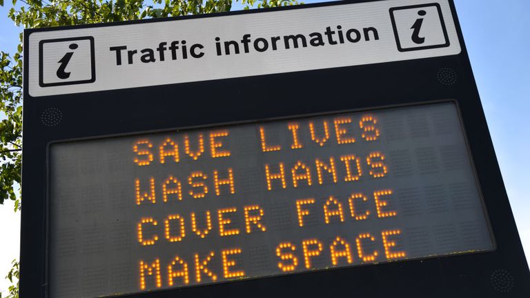 SOUTHEND ON SEA, ENGLAND - OCTOBER 15: An illuminated travel information sign shows a public health safety notice regarding the Coronavirus pandemic saying "Save Lives, Wash Hands, Cover Face and Make Space" on October 15, 2020 in Southend-on-Sea, England. (Photo by John Keeble/Getty Images)