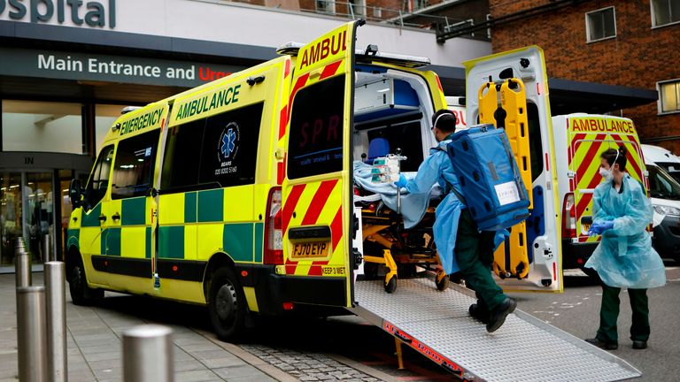 A patient on a gurney is taken from an ambulance parked outside Guy&#39;s Hospital in London on December 29, 2020, as a new strain of the coronavirus appears to be behind the recent upsurge in cases, heaping further pressure on the state-run National Health Service during its busiest winter period. - England is "back in the eye" of the coronavirus storm, health chiefs warned, with as many patients in hospital as during the initial peak in April. (Photo by Tolga Akmen / AFP) (Photo by TOLGA AKMEN/AFP