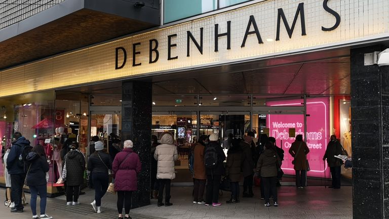 Shoppers queue outside Debenhams as it reopens after England&#39;s lockdown - a day after it revealed it was winding down 2/12/2020