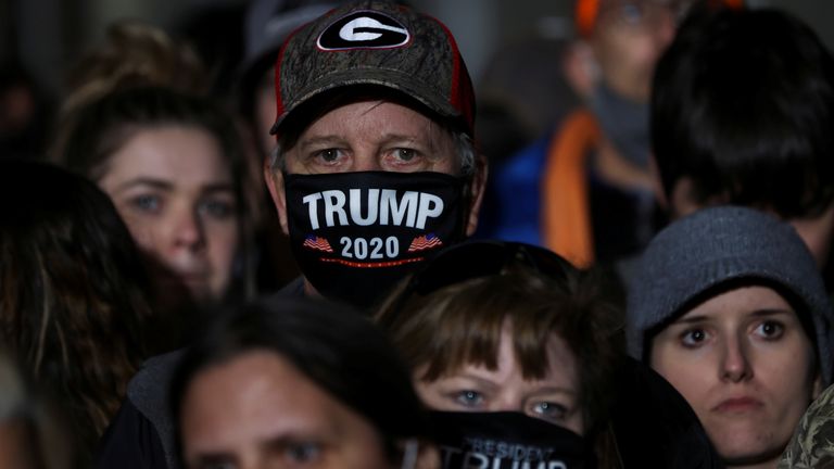 A man wearing a Trump 2020 face mask at a rally in Valdosta, Georgia