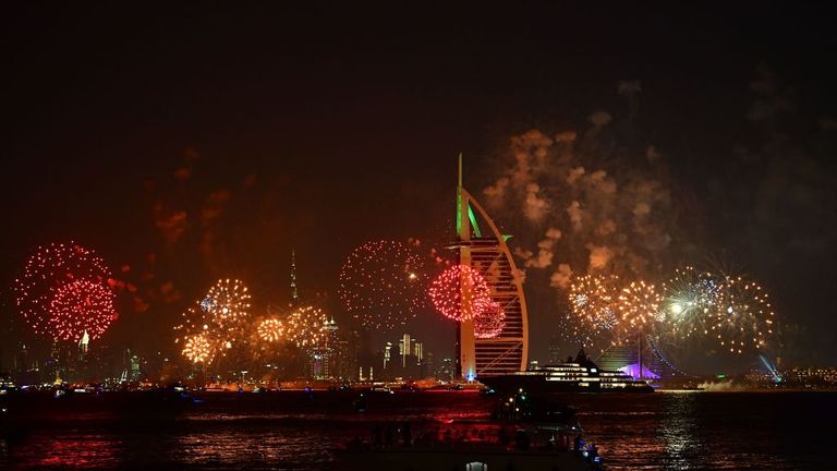 New Year&#39;s fireworks celebrations are seen above the Dubai skyline with the Burj Al Arab (R) and Burj Khalifa (L), the world&#39;s tallest building, on December 31, 2019. (Photo by GIUSEPPE CACACE / AFP) (Photo by GIUSEPPE CACACE/AFP via Getty Images)