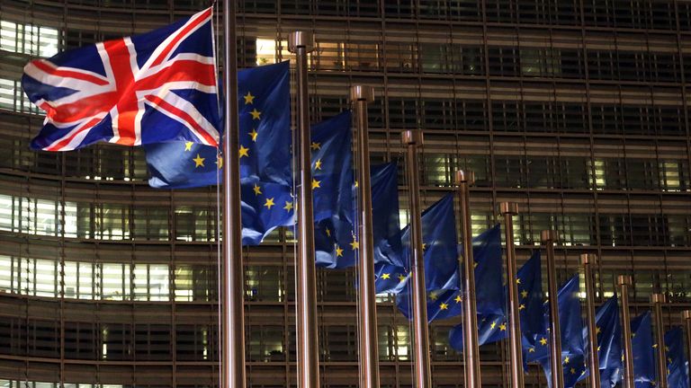 A picture taken on December 9, 2020 shows British and European flags fluttering outside the Berlaymont building, the European commission headquarters. - British Prime Minister Boris Johnson arrived in Brussels for talks with EU chief Ursula von der Leyen to rescue negotiations on a post-Brexit trade deal. (Photo by Fran..ois WALSCHAERTS / AFP) (Photo by FRANCOIS WALSCHAERTS/AFP via Getty Images)