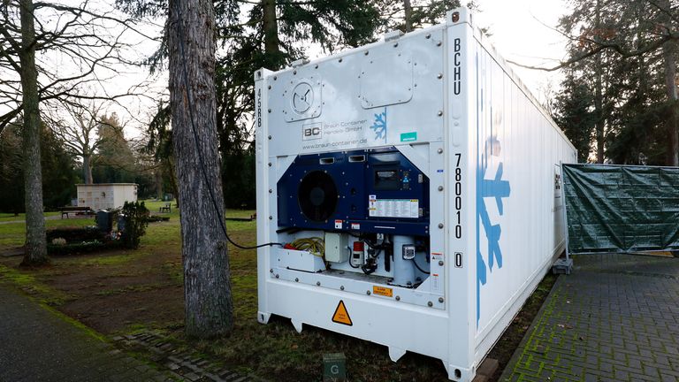 A freezer container, which was set up in April in front of the main cemetery crematorium, is pictured after the numbers of COVID-19 related deaths raised, amid the coronavirus disease (COVID-19) pandemic in Hanau, Germany, December 17, 2020. REUTERS/Ralph Orlowski
