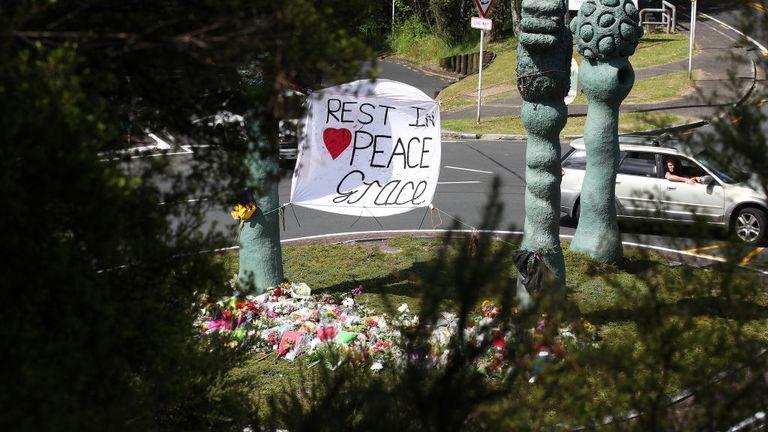 AUCKLAND, NEW ZEALAND - DECEMBER 11: The floral tributes at the Titirangi roundabout grow larger for Grace Millane on December 11, 2018 in Auckland, New Zealand. The body of 22-year-old Grace Millane was found in a section of bush just near Scenic Drive in West Auckland&#39;s Waitakere Ranges on Sunday, following an extensive search for the British tourist. She was seen on Saturday December 1 at the CityLIfe hotel in Auckland. A 26 year old man appeared in Auckland District Court yesterday