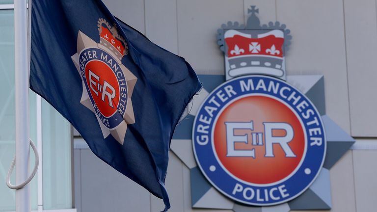 The force flag flies at half mast outside the Greater Manchester Police force headquarters in Manchester , northern England, September 19, 2012. One of Britain&#39;s most wanted fugitives killed two unarmed policewomen on Tuesday in a gun and grenade ambush, police said, killings which are likely to reignite a long-running debate over whether British officers should carry guns. REUTERS/Phil Noble (BRITAIN - Tags: CRIME LAW)