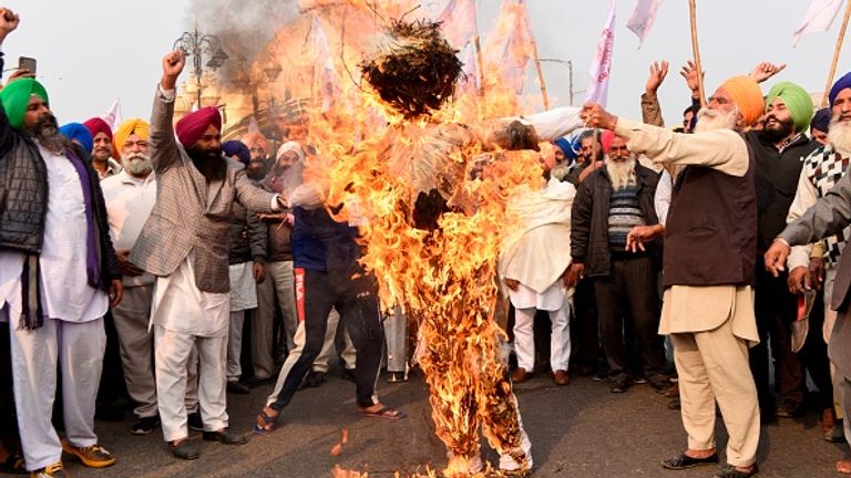 Farmers in Amritsar burned an effigy of the prime minister and other figures last week 