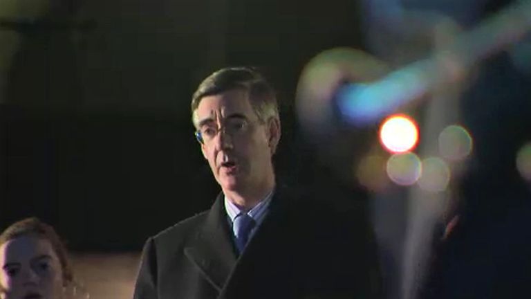 Leader of the Commons, Jacob Rees-Mogg, at a socially-distanced Christmas carole ceremony at New Palace Yard, above Parliament&#39;s carpark.