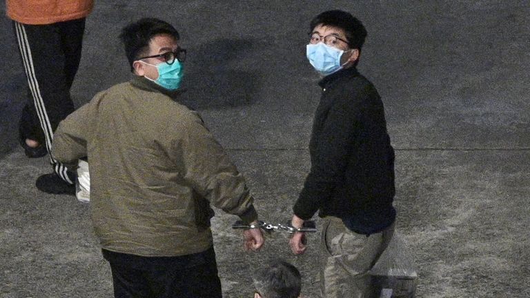 Activists Joshua Wong (R) and Ivan Lam (L) pictured in Hong Kong after being sentenced