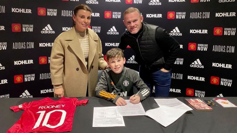 Kai Rooney pictured with his parents as he signs his Manchester United youth academy contract Pic: @WayneRooney