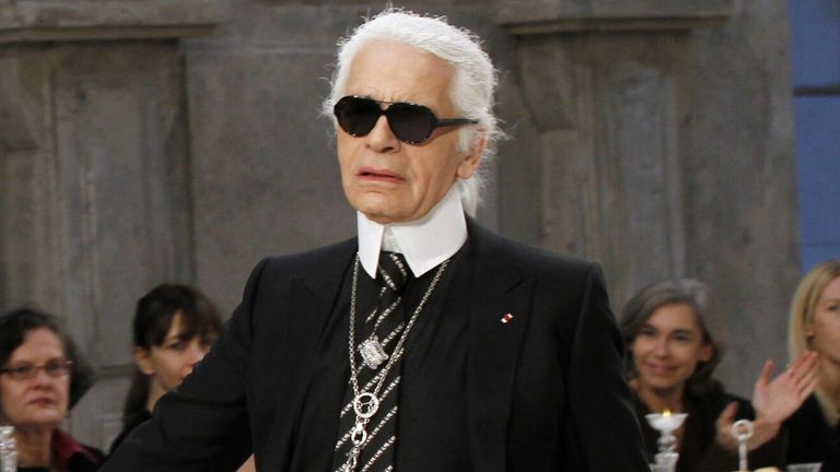 Fashion designer Karl Lagerfeld (R) and British model Stella Tennant pictured during the Chanel Metiers d'Art Pre-Fall collection show, entitled 