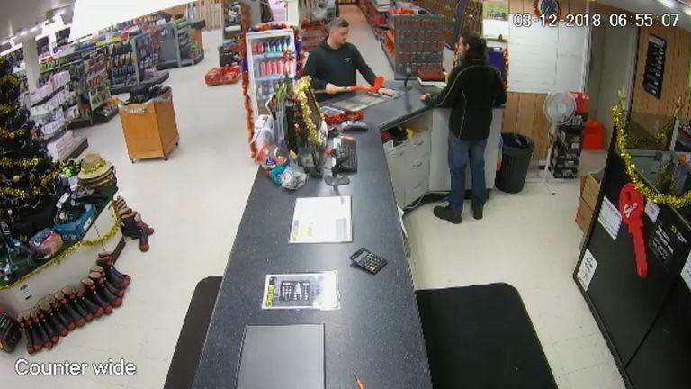 Kempson is seen buying a spade from an out of town hardware store