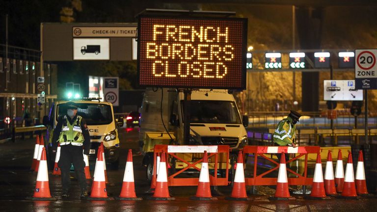 Police and port staff turn away vehicles from the Port of Dover in Kent
