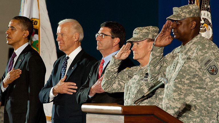 Lloyd J Austin, far right, is seen with Barack Obama, far left, and Joe Biden, second left, in 2011